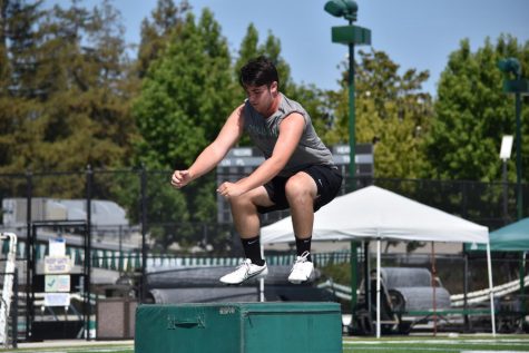 Marcus Anderson (12) performs a box jump at a workout hosted on Davis Field during summer break. Box jumps are an effective exercise for strengthening the lower body, increasing one’s vertical jump. and improving athletic explosiveness overall.