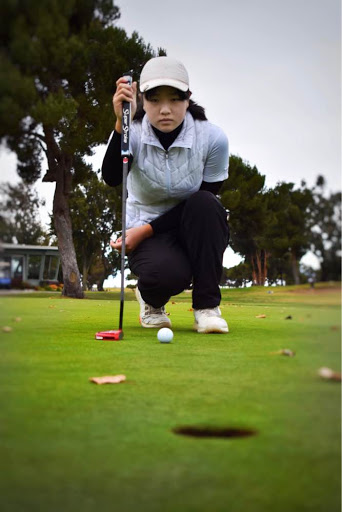 Claire Chen (10) intently examines the target hole before her shot. Last year, Claire finished 3rd in CCS and 5th in NorCal for girls golf.