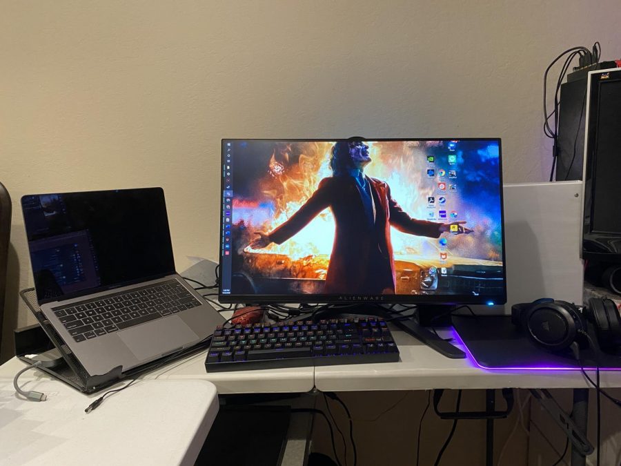 I have my mac and my PC, which are connected to this monitor and are hooked up to a KVM with which i switch my keyboard and mouse between. I also have headphones, a mousepad and mouse. I would like to make the space less crammed in the future and I would like to clean it up.

