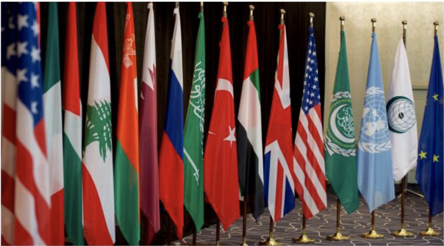Flags of different countries stand outside a 2016 meeting of the International Syria Support Group. “I think we can all come together and agree that Bidens vision of America is a fundamentally more optimistic one.” Youth Activism Club president Ethan Choi (12) said. “And its one that values the impact of immigrants so much more so than [former President] Trump.”