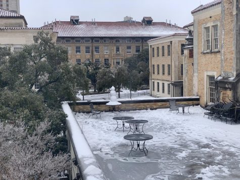 Snow covers the quad next to the cafeteria at the University of Texas at Austin. The university closed campus on Feb. 14 and reopened on Feb. 24 due to the water outage and hazardous weather conditions.