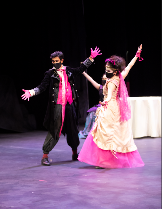 Zubin Khera (10) and Maya Franz (12) dance onstage during a dinner party scene in the play. 
