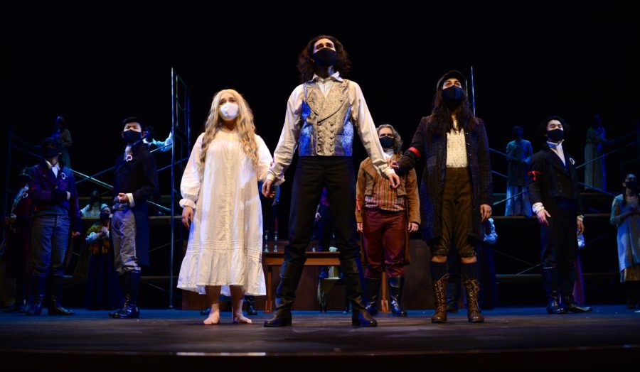 Seniors Ruya Ozveren, Alex Kumar, and Vaishnavi Murari sing in the closing scene of the spring musical Les Misérables with the entire cast on March 19. Unlike the format of the Fall Play and Student Directed Showcase (SDS), Performing Arts Director Laura Lang-Ree converted the musical into a movie, where multiple video angles are used and the audio is recorded beforehand. 