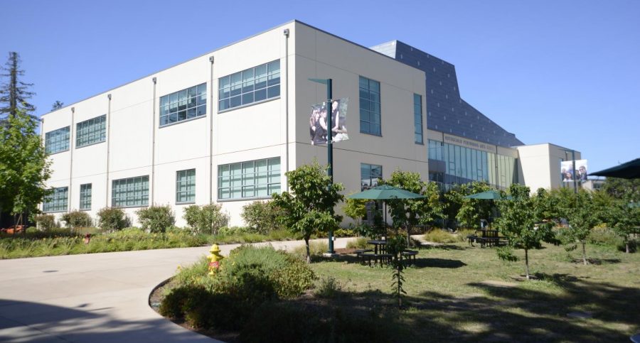 The Rothschild Performing Arts Center. The orchard was one of many places on campus set up with picnic tables for social distanced student seating.