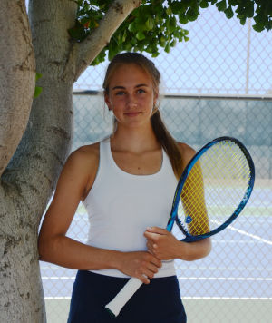 Emily Novikov (11) poses outside the Blackford Campus tennis courts with her Yonex Ezone 98  tennis racket. Emily helped lead the varsity girls tennis team to a CCS Championship in her sophomore year.