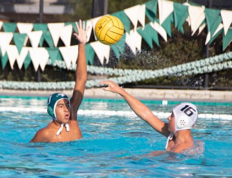 Oliver Roman (9) blocks a pass from an opposing player during the junior varsity water polo teams match against Los Gatos on Tuesday. The boys won 13-3.