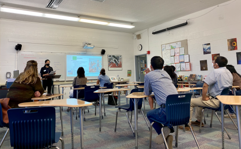 Intro to Journalism teacher Whitney Huang speaks to parents during sixth period in Main 5. Back to School Day was held on Saturday to give faculty the opportunity to introduce parents to their childrens classes this school year. 