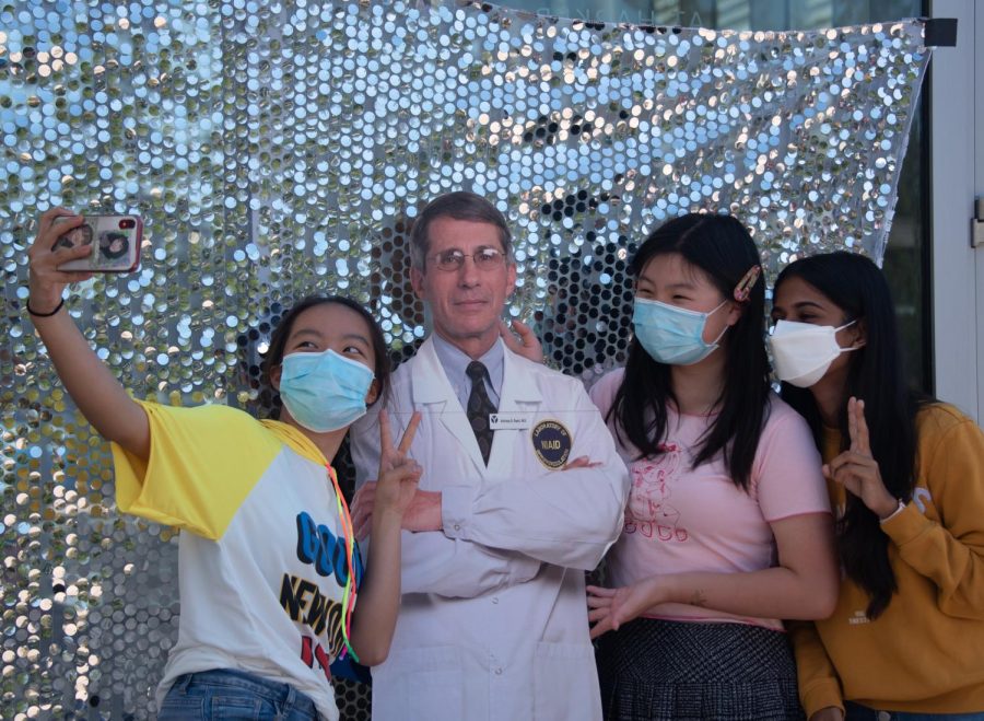 Juniors+Karina+Chen%2C+Jessica+Zhou+and+Anika+Pandey+pose+with+a+cardboard+cutout+of+Director+of+the+National+Institute+of+Allergy+and+Infectious+Diseases+Dr.+Anthony+Fauci.+The+cutout+traversed+through+the+different+areas+of+the+event+as+various+people+took+photos%2C+posed+with+it+or+in+some+cases+even+danced+with+cardboard+Fauci.