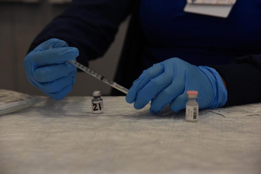 A nurse prepares a Pfizer booster shot at the San Jose Valley Medical Center on October 18. After preparation, the booster can then be administered to elderly and immunocompromised citizens.