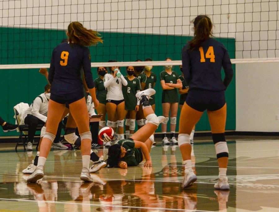 Rachel Ning (11) falls to the ground as she reaches for the ball.