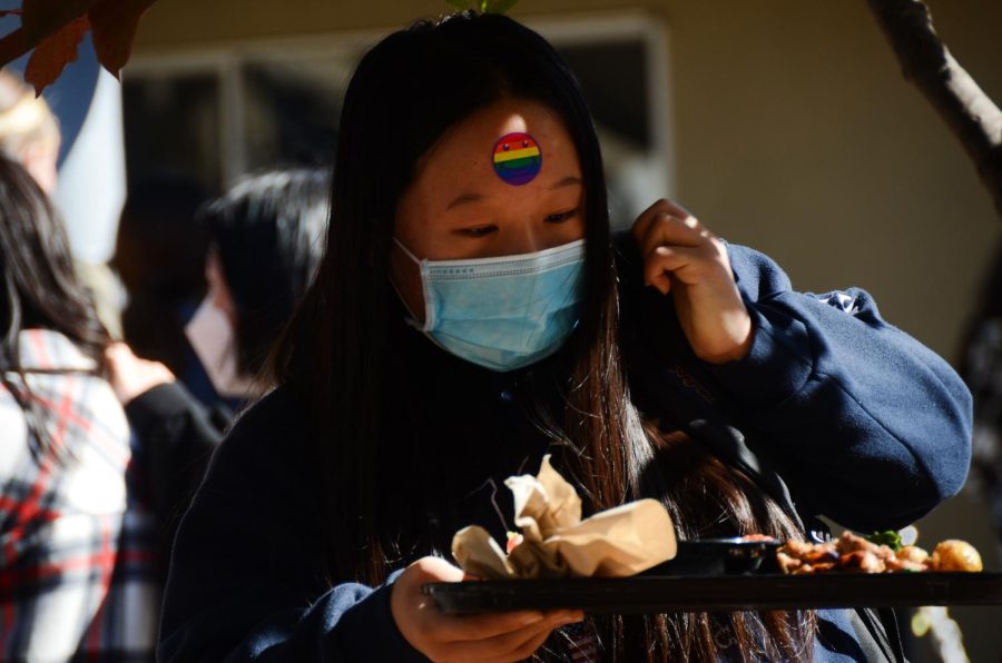 Walking out of Manzanita with lunch, Selina Chen (10) wears a rainbow smiley face sticker.
