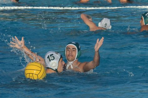 Rajas Apte (9) presses a Leigh player while on defense. The varsity boys water polo team participated in the Silicon Valley Invite Tournament this past weekend.