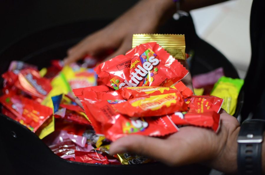 A mixture of candy rests in a cauldron from Harker Spirit Leadership Team adviser and Director of Student Organizations Eric Kallbrier. This Friday Five repeater ranks top five brands of Halloween candy.