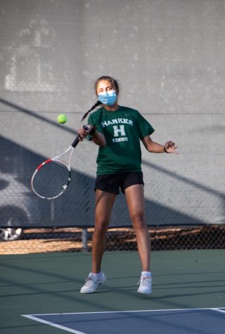 Anishka Raina (12) swings at the tennis ball during the varsity girls tennis teams win over Notre Dame Belmont.