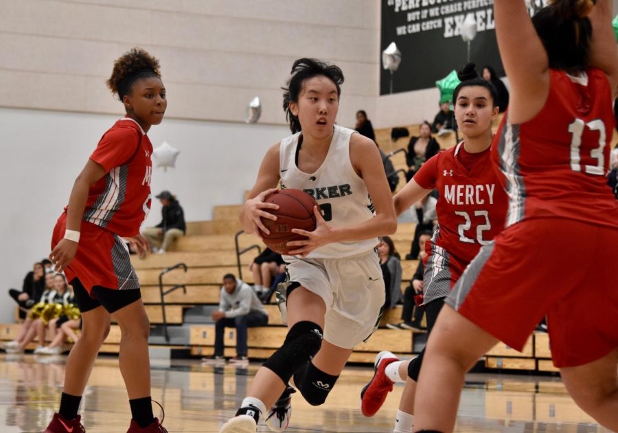 Alexa Lowe (10) drives to the basket during a Senior Night match against Mercy High School on Feb. 7, 2020. 