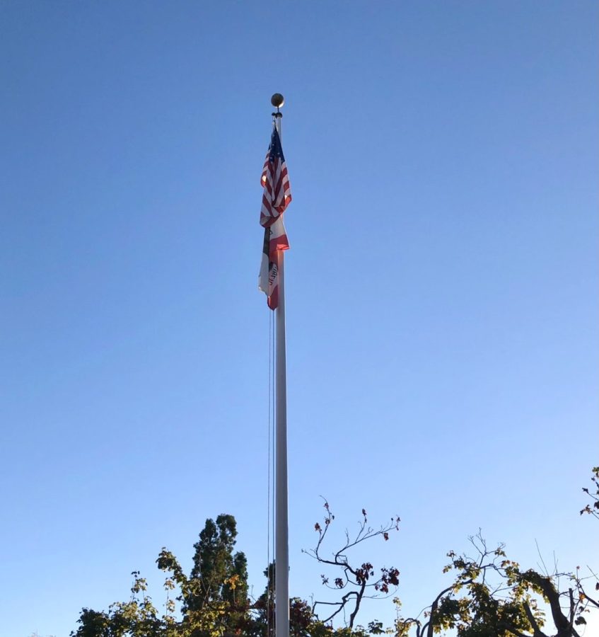 The American and California flag fly at full-staff in the quad. Veterans Day, a federal holiday observed today, honors everyone who has served in the U.S. military through a variety of homages across the country.