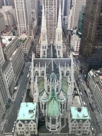 The Gothic revivalist spires of St. Patricks Cathedral in Manhattan contrasts with its surrounding skyscrapers. 