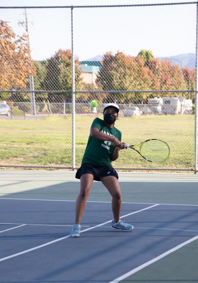 Anandita Arun (9) swings at the ball during the varsity girls tennis teams win over Notre Dame Belmont on Sept. 28.