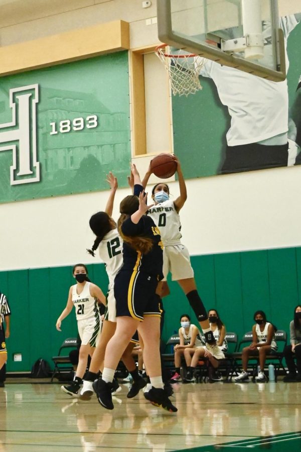 Anjali Yella (10) leaps up with the ball in hand for a jump shot.