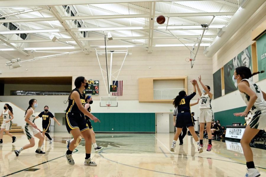 Gemma Chan (9) shoots the ball for a 3-pointer during the last quarter.