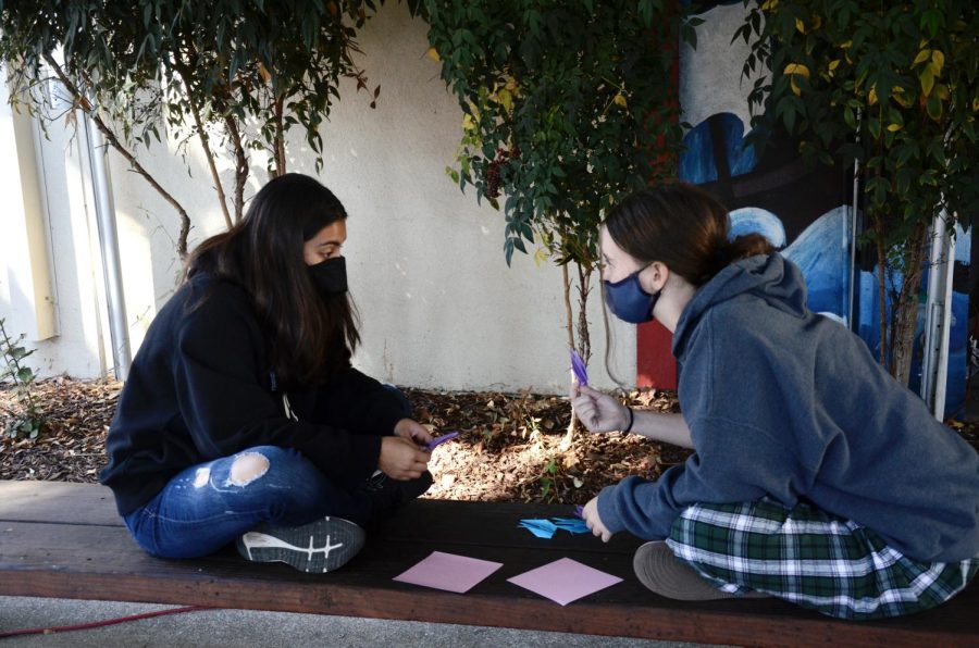 Sarah Westgate (10) and Saloni Shah (10) work together on their cranes for Keller. The project was a way to show support for Keller as she undergoes chemotherapy and gave students an opportunity to participate in a school-wide activity together. 