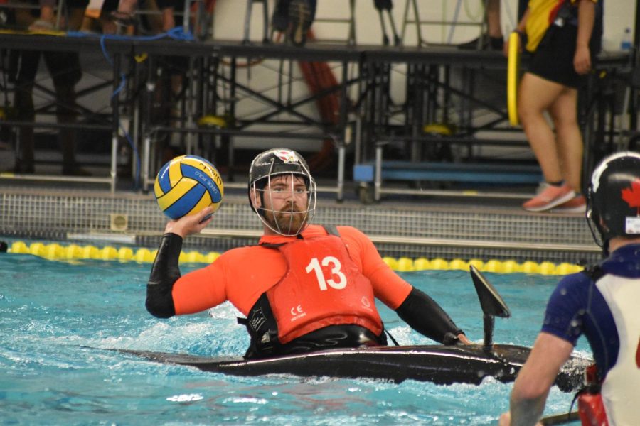 Mr. Irvine prepares to throw the ball at a recent Kayak Polo tournament.