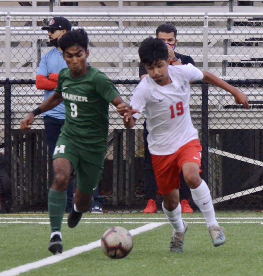 Ishaan Mantripragada (12) pushes past a North Salinas defender in attempt to secure the ball.