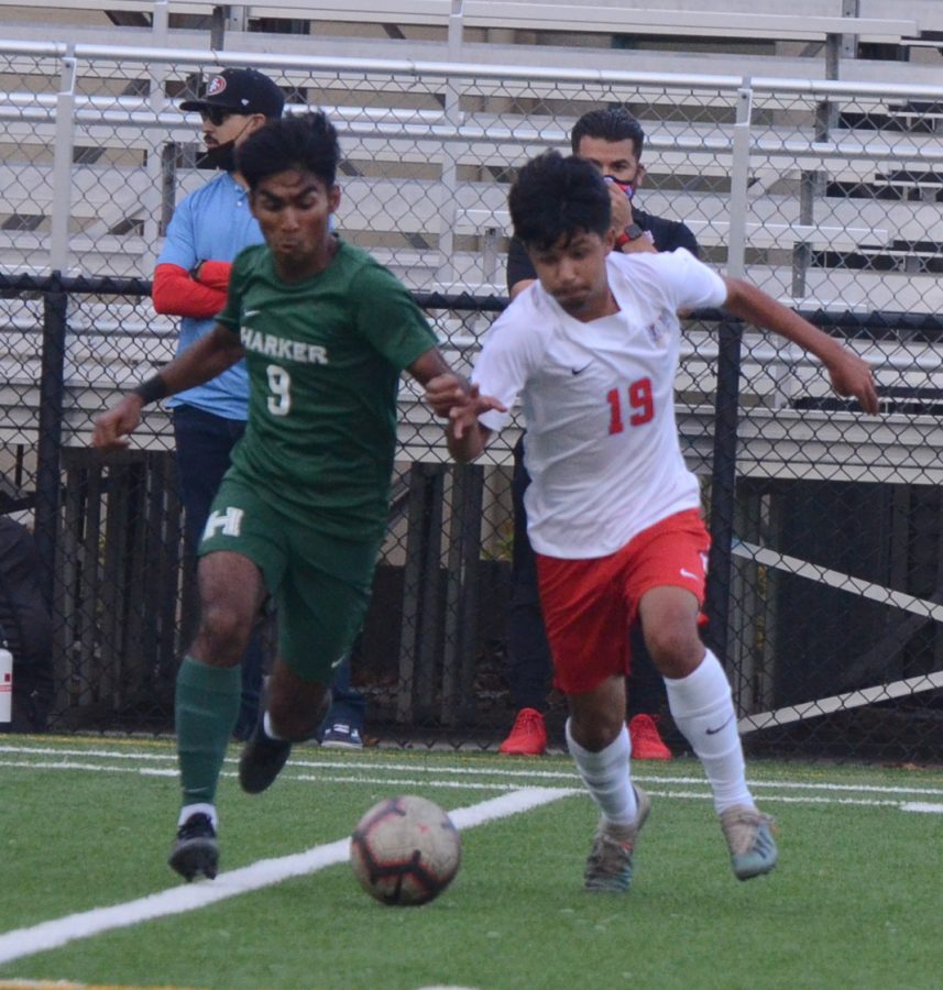 Ishaan Mantripragada (12) pushes past a North Salinas defender in attempt to secure the ball.