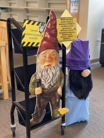 A gnome cutout greets students as they enter the library, a reminder of the dead quiet study zone enforced during finals week and an invitation to explore the gnome stations scattered around the library.