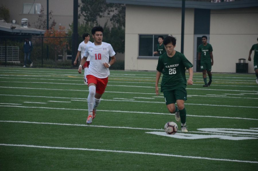 Jack Yang (10) dribbles the ball down the field.