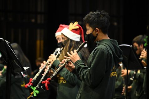 Richard Zhang (11) plays with the orchestra during the Big Assembly Day opening number, Sleigh Ride. Big Assembly Day occurred on Friday, Dec. 9. 
