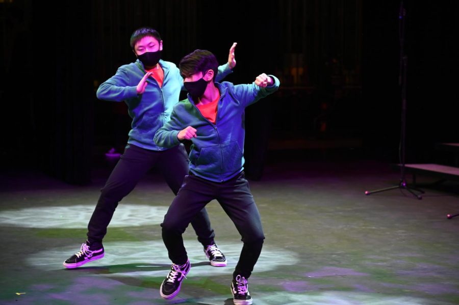 High Voltage members Evan Yuan (7) and Justin Yang (8) perform to a remix of holiday songs. The routine was choreographed by dance teacher Kento Vo.