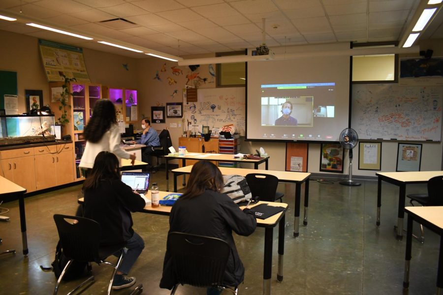 Upper school biology teacher Jeff Sutton's advisory watch the school meeting via Zoom this Tuesday. After the meeting, students underwent the first iteration of weekly COVID-19 testing.