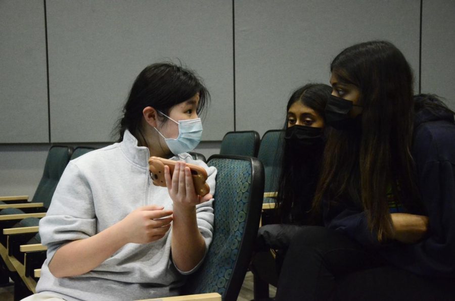 HOSA (Health Occupations Students of America) Operations officer Jessica Zhou (11) explains club details to Nila Dharmaraj (10) and Smrithi Sambamurthy (11) on Jan. 11. The club focuses on medical events and contests.