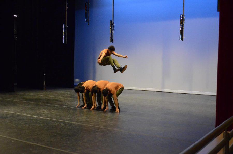 Kai Due (12) jumps over four other dancers during September, a song from the 2014 show. The performers of the September routine were all senior dancers on the dance teams. 
