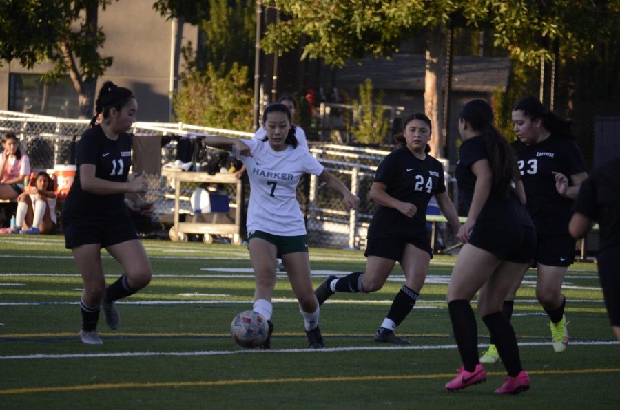 Heidi Lu (10) vies for control of the ball against Eastside College Prep players.