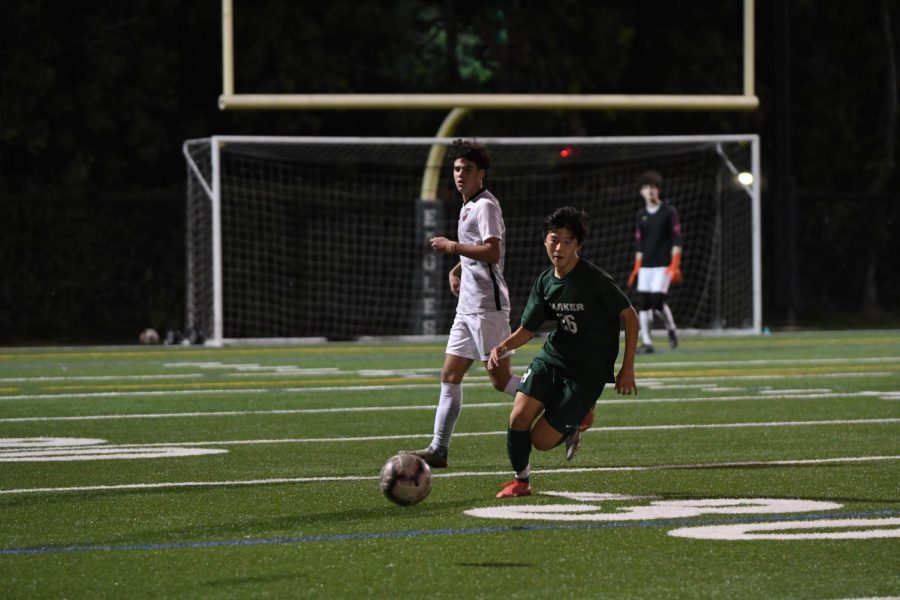 Jack Yang (10) chases after the ball.