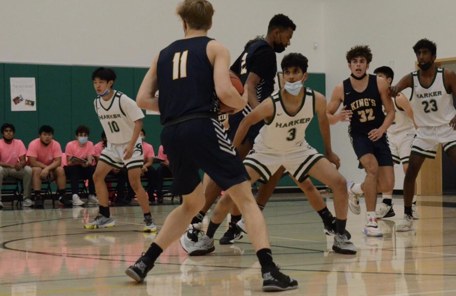 Vedant Kenkare (12) guards a Kings Academy Knight, preventing him from scoring a point in the first quarter. The score by the end of the first quarter was 6-15.