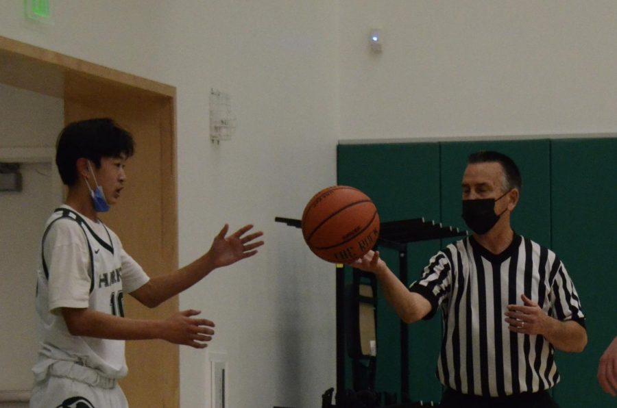 Point guard Bowen Xia (9) receives the ball from the referee during the second quarter as he looks to pass the ball in bounds to another Eagle. The score by the end of the first half was 23-29.