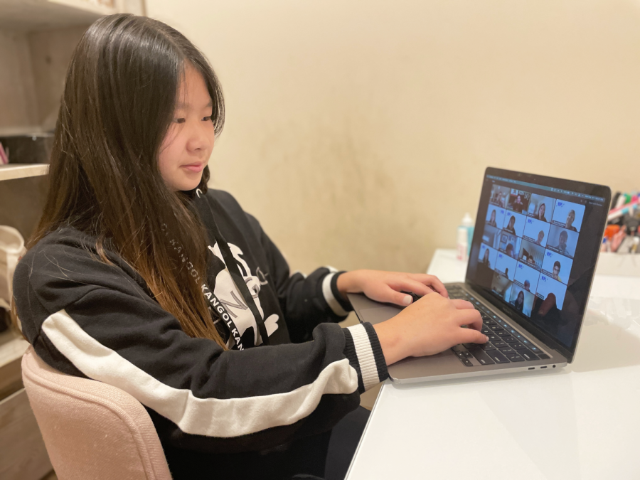 Eighth-grader Tiffany Zhu listens to the panel event during the Harker Programming Invitational (HPI) on Mar. 13. Middle and high school students participated in HPI virtually.