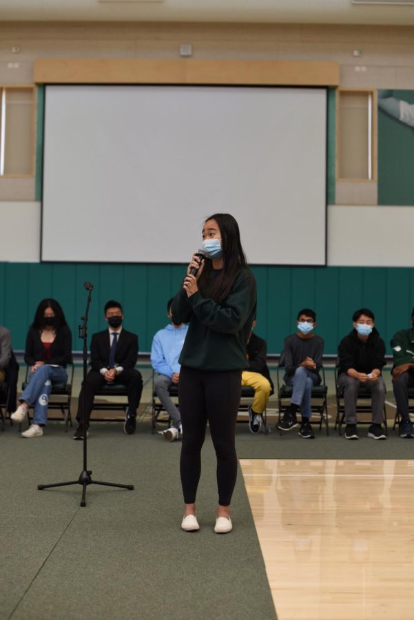 Next years ASB Secretary Michelle Jin (11) holds the microphone while giving her speech in the Athletic Center on Monday. Michelle brought up the idea of using the ASB Instagram page to post announcements and the ASB website to post meeting minutes.
