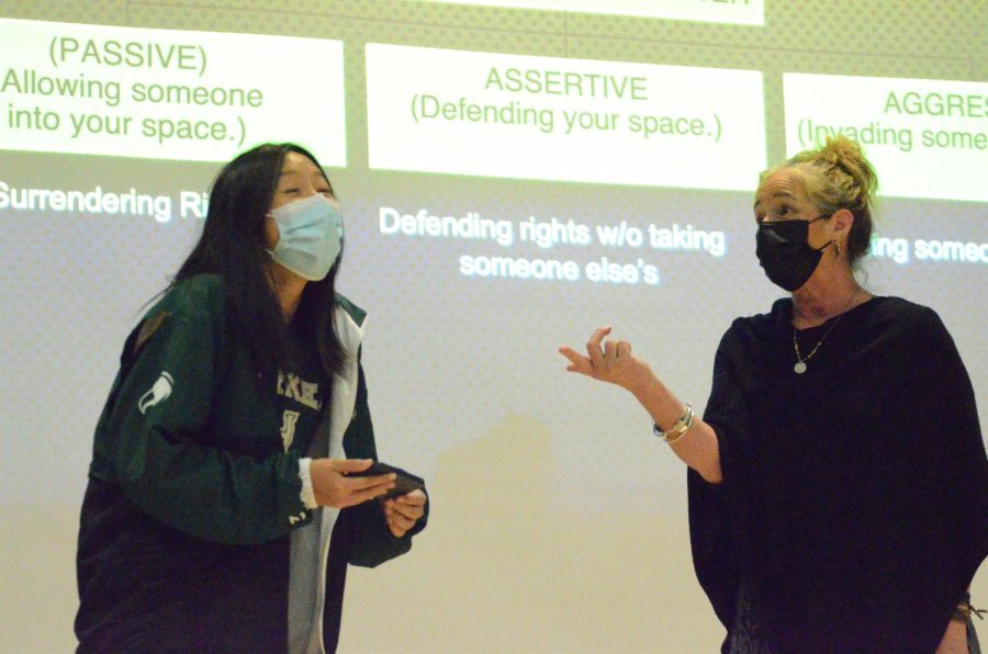 Alex Fu (10) interacts with youth advocate Charis Denison as part of a roleplay during the sophomore LIFE session. Denison reenacted various situations with students and shared advice about handling uncomfortable social situations.