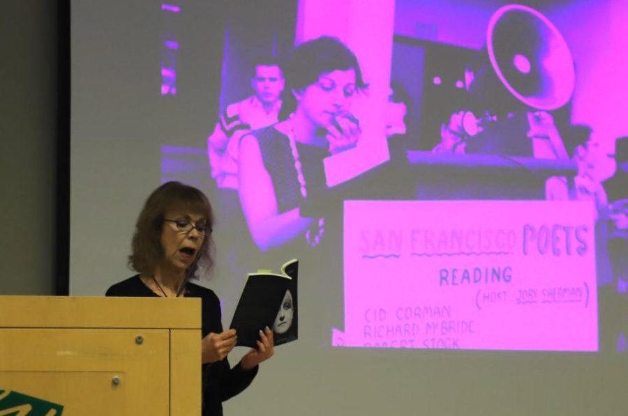 Estelle Cimino, who visited the upper school campus with the Beat Museum on Wheels, reads a poem from Beat Generation author Ruth Weiss at their speaker event on Feb. 24. The BeatMobile came to the campus for the day to educate about the Beat Generation authors of the 1950s. 