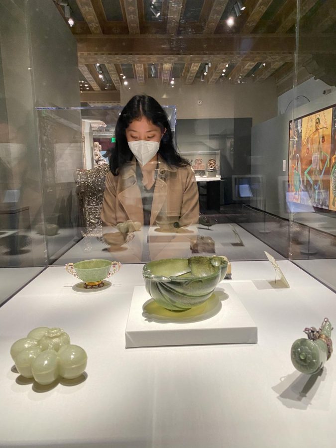 Nicole Tian (12) reads a description for Indian jade carvings in the Asian Art Museum during a field trip for Advanced Placement (AP) Art History field trip on March 21. The students spent the day exploring the different exhibits of the museum, which included sculptures, paintings and ceramics from different parts of Asia.