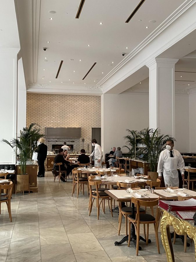Servers walk around the dining area at the Bottega Louie restaurant in Downtown Los Angeles. Though spacious, the large dining area led to a loud environment. 