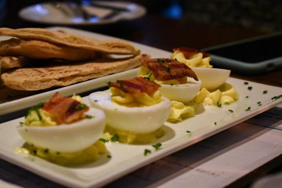 Deviled eggs get served to the table as a part of a set group of appetizers. The Proper Restaurant & Bar, located in Pasadena, serves Italian cuisine and scratch food dishes. 