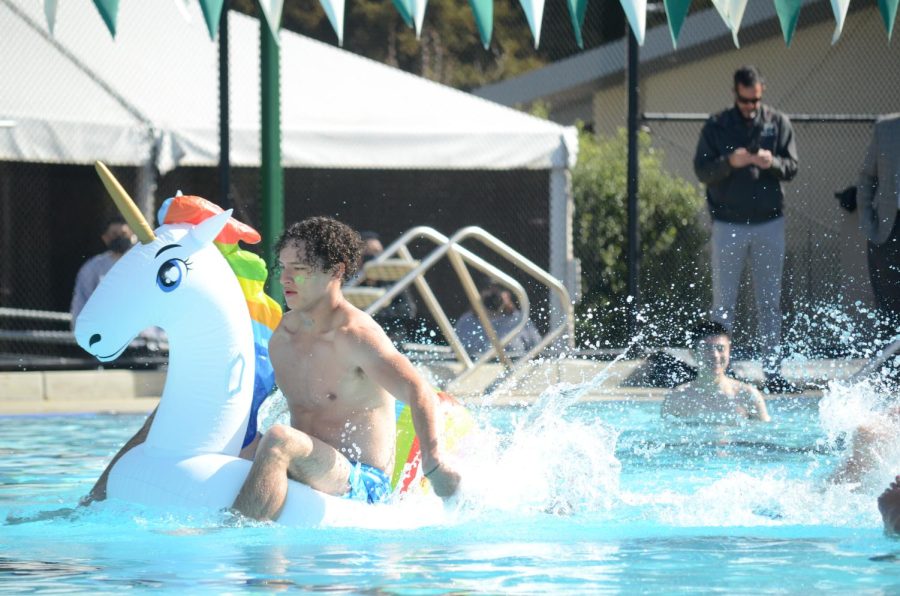 Kai Burich (12) travels across the pool during the regatta competition in the Singh Aquatic Center. The seniors ended the race in last place, while the juniors came in first and the sophomores in second place. The freshmen team unintentionally popped their float, prompting a disqualification.