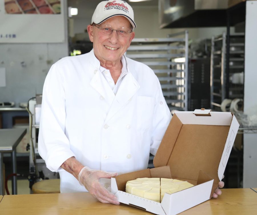 Charlie Major, owner of Bay Area cheesecake store Charlies Cheesecake Works, poses with a classic cheesecake. Major, who started the store 20 years ago, still runs the shop to this day, selling three varieties of cheesecakes in 40 unique flavors. 