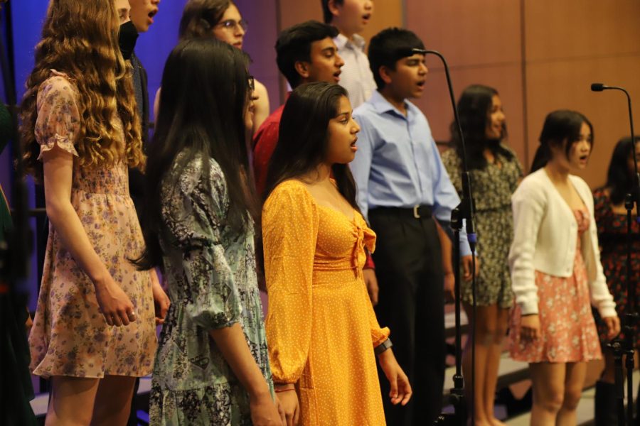 Members of Bel Canto perform at a dress rehearsal for the Choirs In Concert. The concert, themed Peace, Hope, Love, took place in the Patil Theater on April 21.