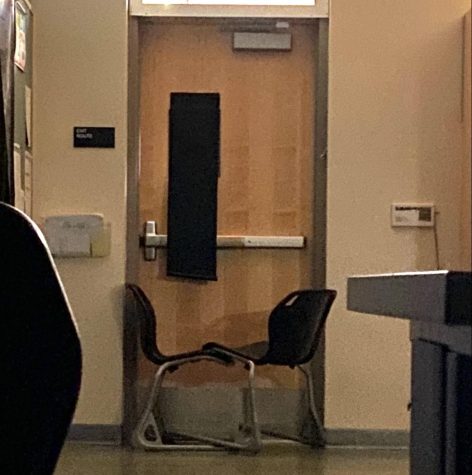 Two chairs are pushed against the door in the Nichols 307 classroom during the shelter-in-place (SIP) at the upper school campus today. The school activated SIP this afternoon after an unarmed intruder entered the campus, and all students and staff are safe.